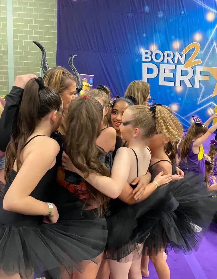 Junior team celebrating backstage